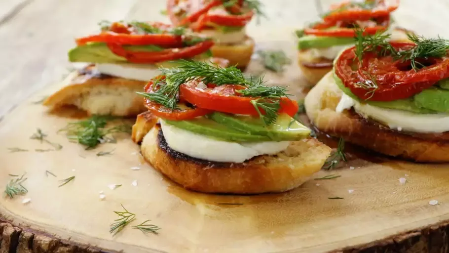 Roasted Tomato, Avocado, and Fresh Mozzarella Crostini